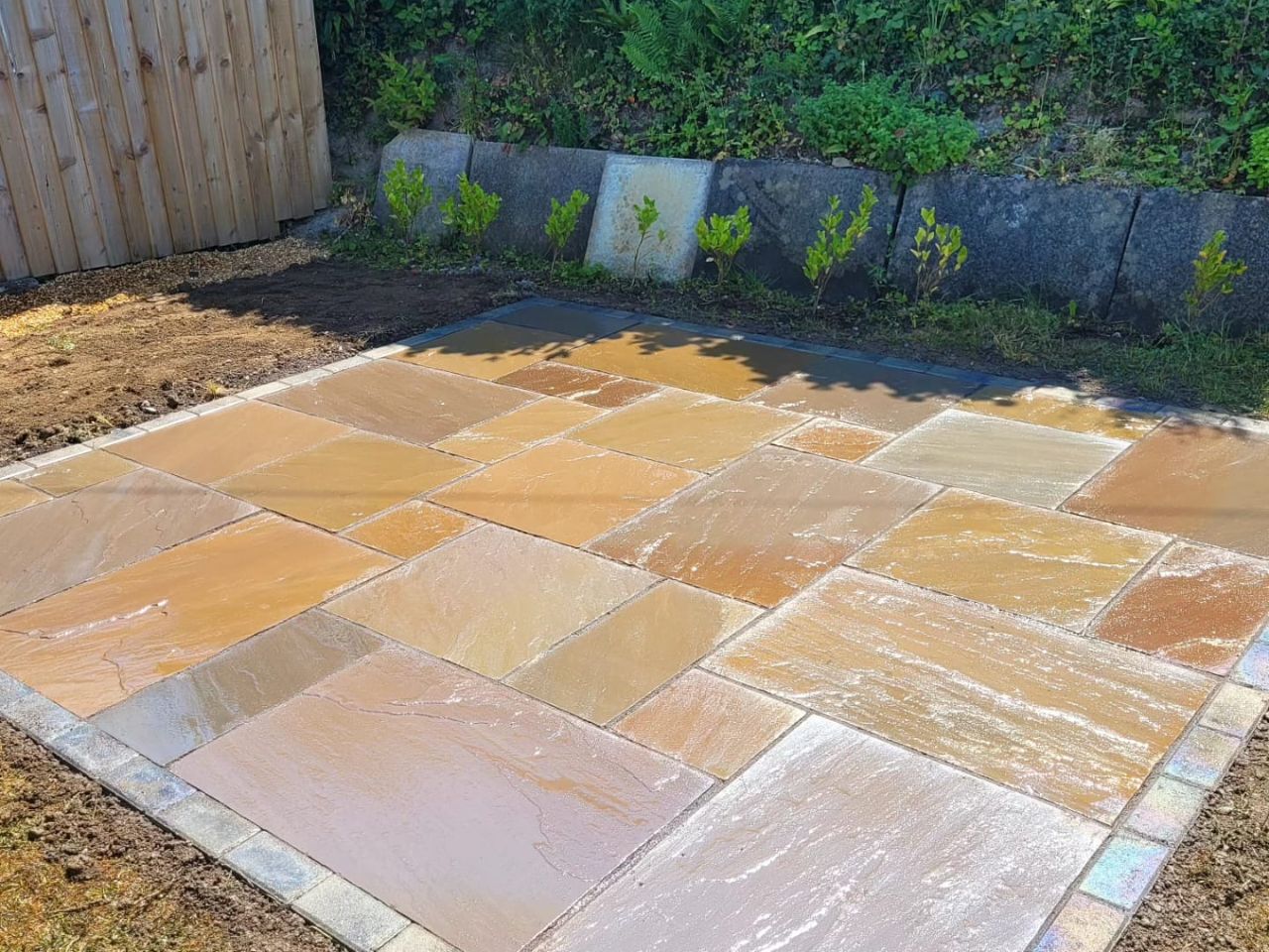 Sandstone patio with sett edging