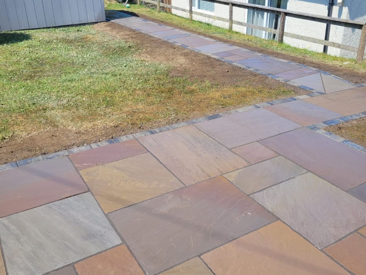 Sandstone path and patio with sett banding